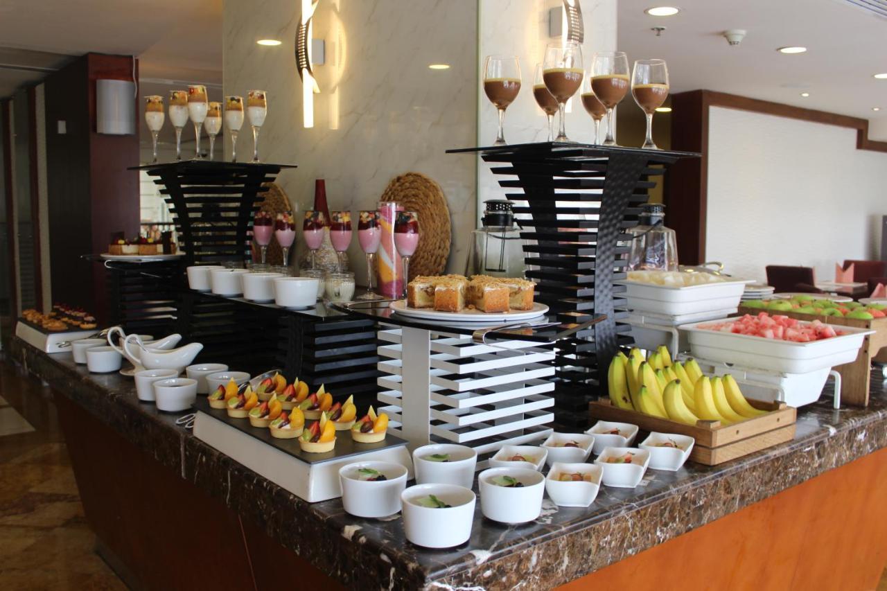 Grand Regency Doha, Trademark Collection By Wyndham Exterior photo A dessert buffet